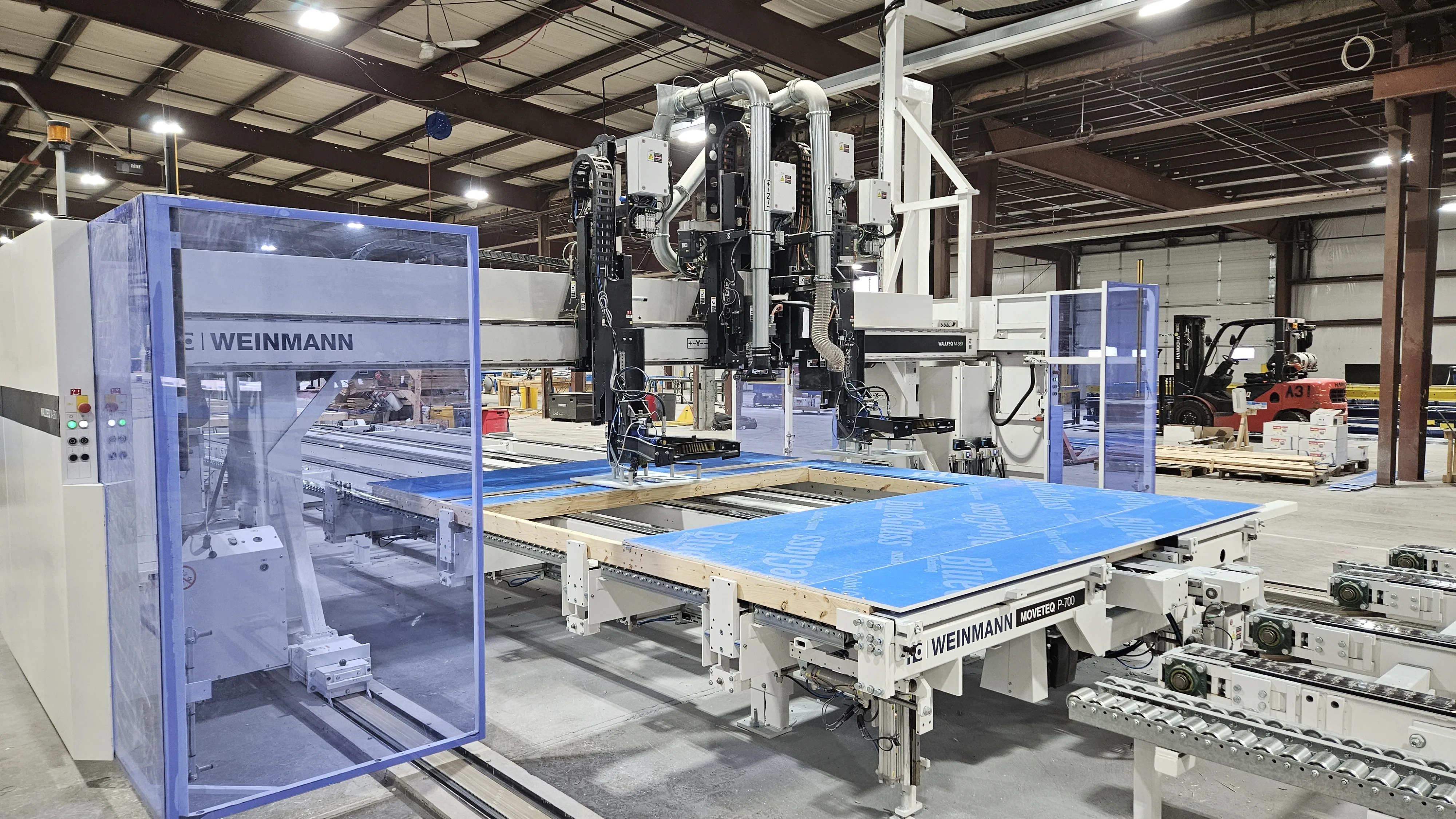 Automated wall and floor panel manufacturing line